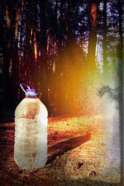 Food safe recycled plastic water bottle reused and refilled with more water. This one has a built in handle!